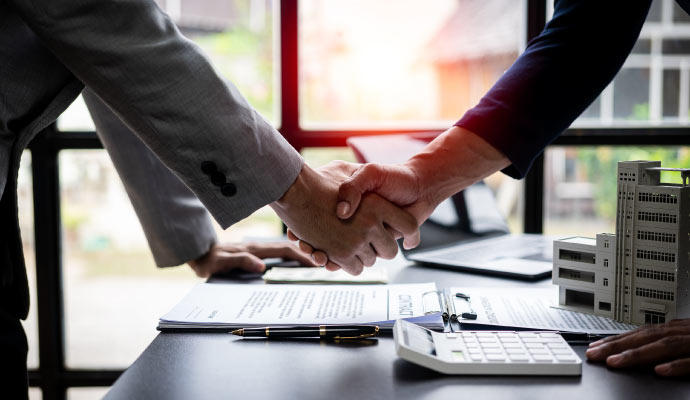 person shaking hand after insurance agreement